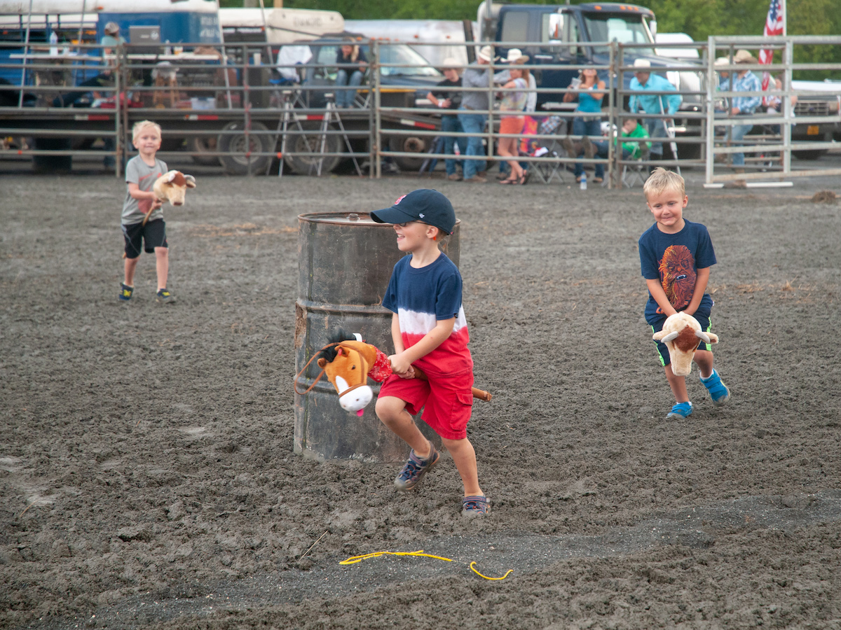 Kids riding fake horses at the Loudoun County Fair